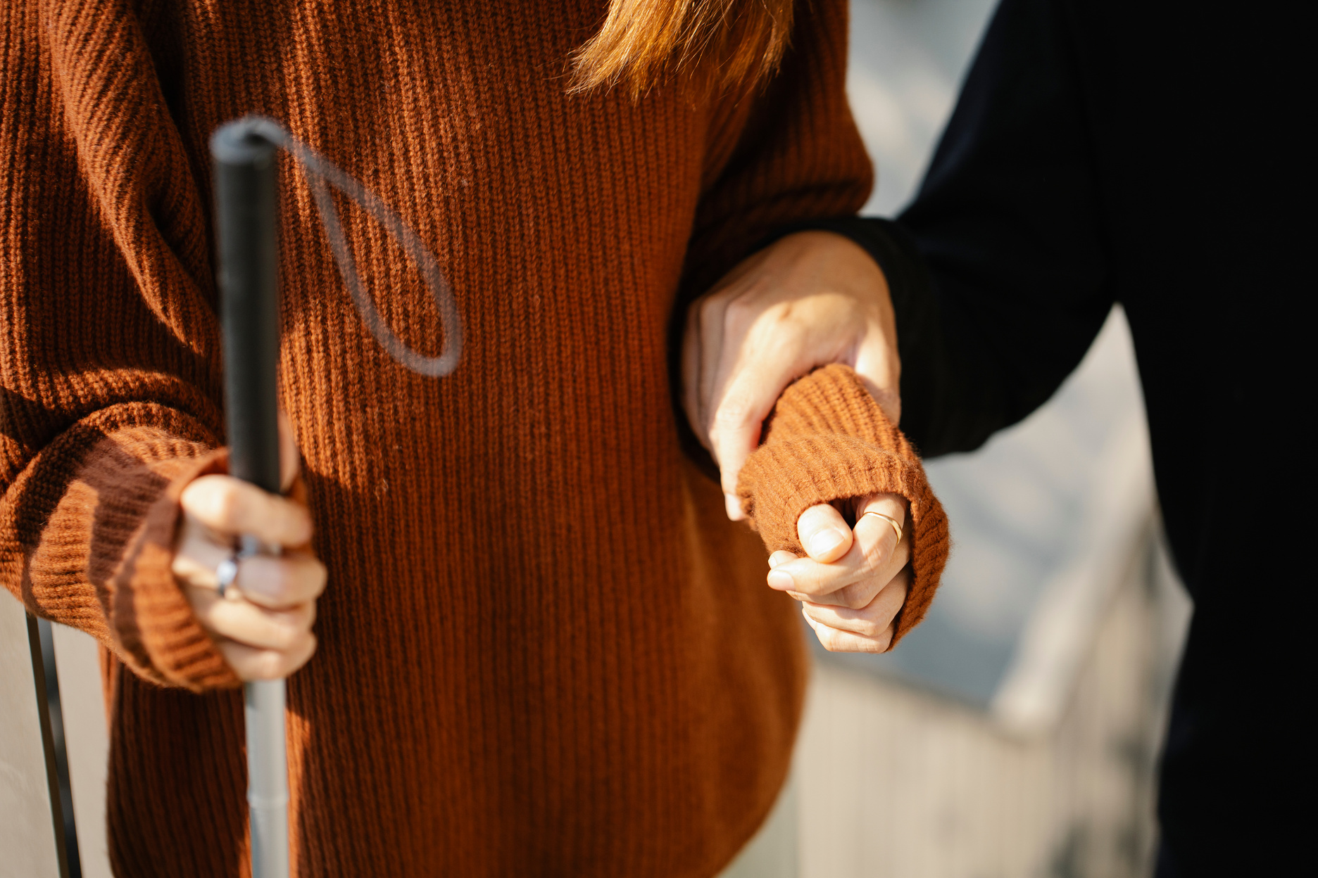 Photo of Man Holding on Woman's Arm